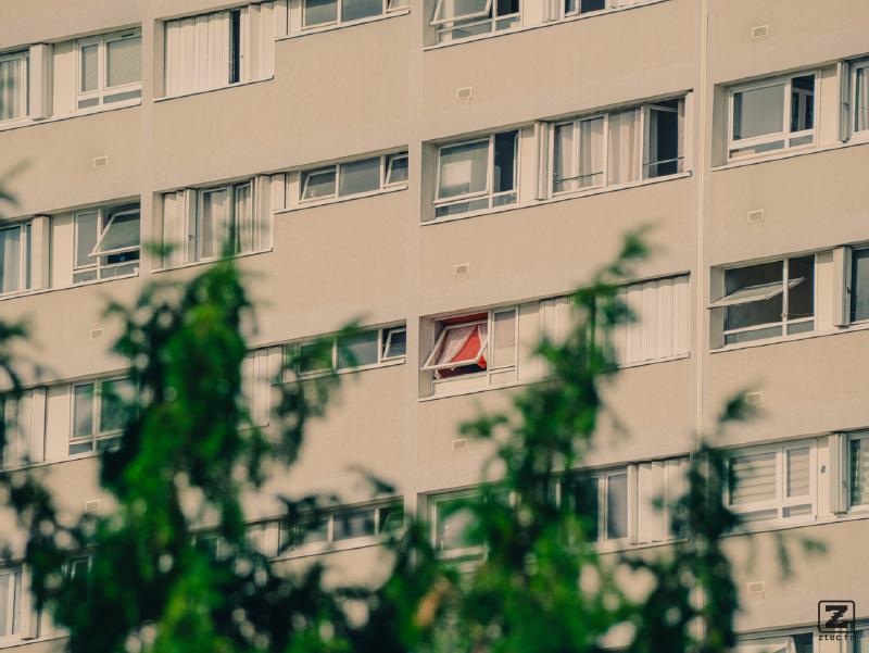 A red window among white windows
https://www.flickr.com/photos/ztec/54726364119/