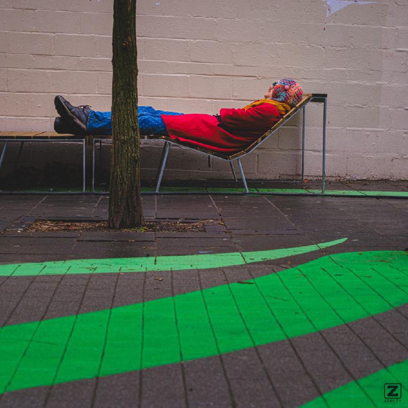 Someone napping in a cold, cloudy and rainy environment.