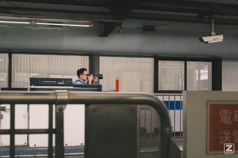Someone is taking picture of train at a train platform
