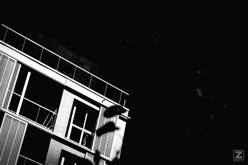 Picture of a building corner taken from below. It is highly contrasted with near black and near white colors.
https://www.flickr.com/photos/ztec/53132785349/