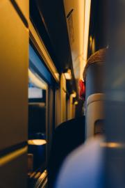 Closeup of someone ear siting on the train