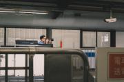 Someone is taking picture of train at a train platform