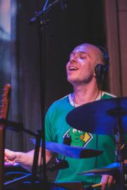 Mackwood enjoying playing drums