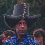 A man with a Hat made of sound dampening materials