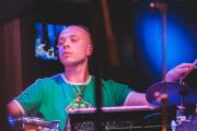Mackwood playing drums
