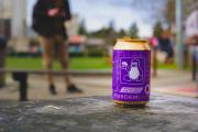 A can of FOSDEM beer brew. Purple with a Tux on it.