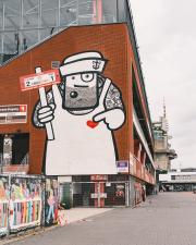 A gigantic street art on a wall of a stadium in Hamburg
