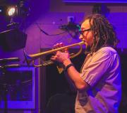 Theo Croker playing trumpet