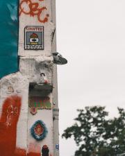 Street art on the wall, including a WANTED poster of Mr Fry