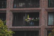 A flat balcony in Hamburg with a closed yellow sun-shade