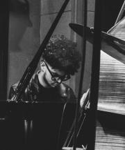 Tyler Bullock II playing Piano at Theo Croker concert