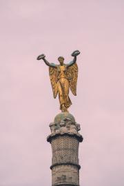 An angel on top of a column/monument in Paris