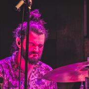Drummer heavily concentrated in drumming