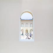 People visible though a hole in a wall in a museum