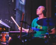Mackwood playing drums