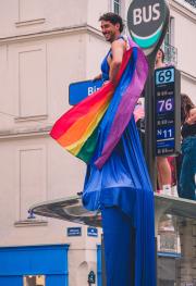 A person on top of a bus stop with a blue dress