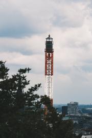 top of a free fall  fairground attraction with Hamburg in the back