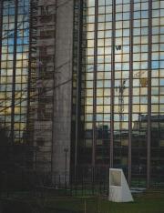A Palestinian flag hanging of a window on a small sky scraper in from of the ULB Brussel. 
