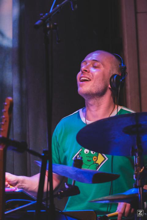 Mackwood enjoying playing drums