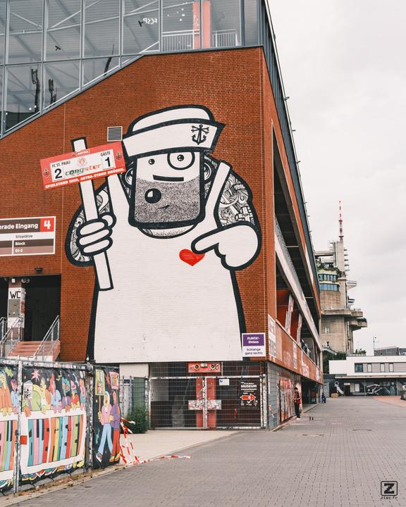 A gigantic street art on a wall of a stadium in Hamburg