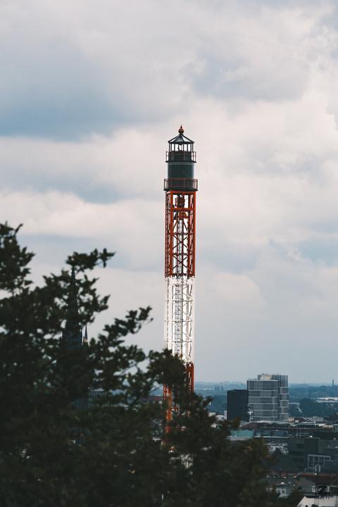 top of a free fall fairground attraction with Hamburg in the back