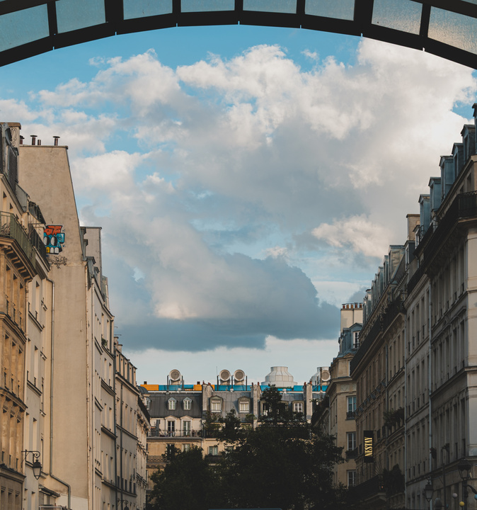 Typical parisians building with some elements from the Beaubourg museum over the roof of the center building. 