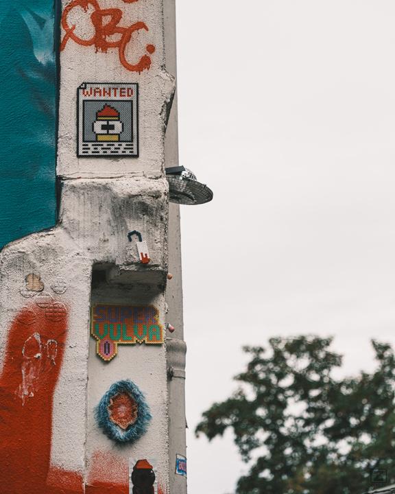 Street art on the wall, including a WANTED poster of Mr Fry