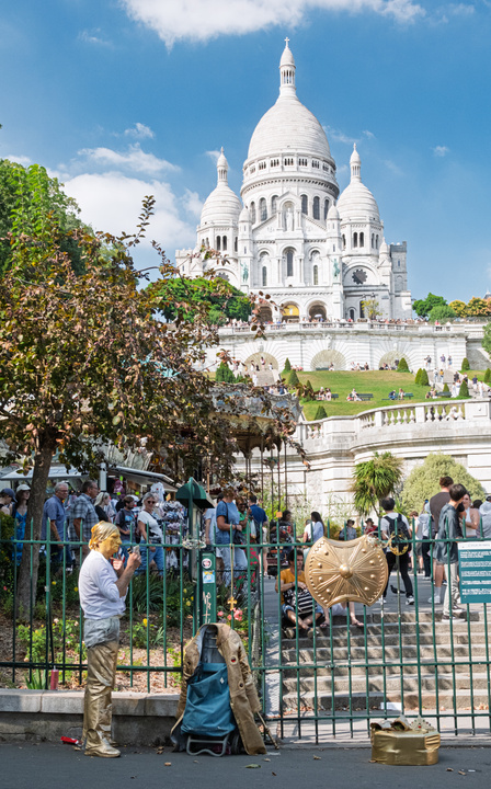 A man painting himself in gold in front of the Sacré Coeur
https://www.flickr.com/photos/ztec/54726143436/