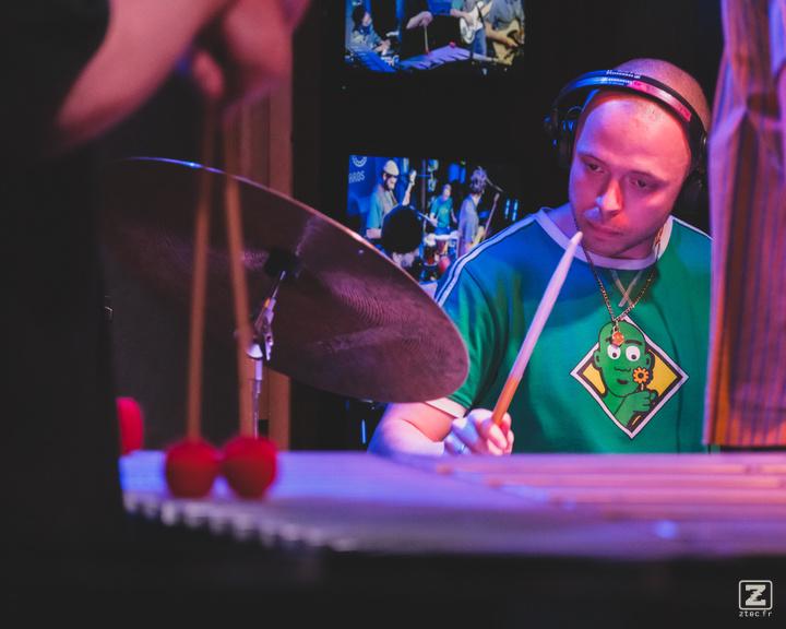 Mackwood playing drums