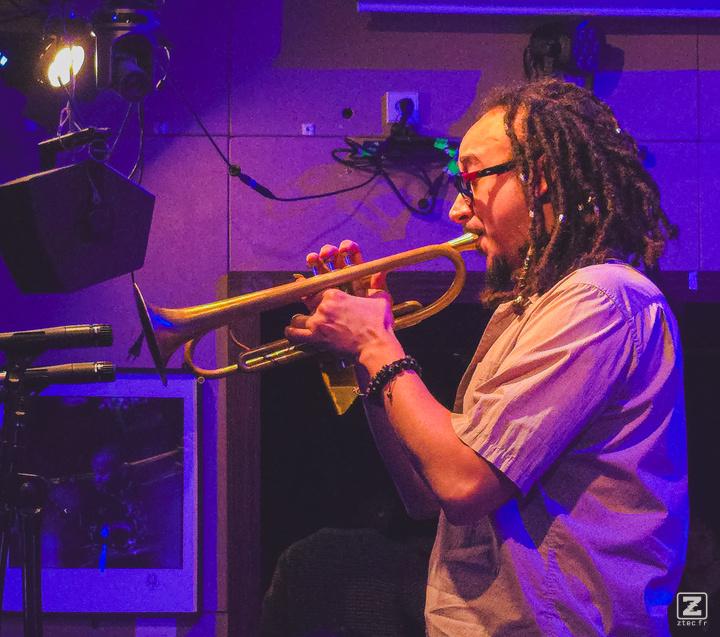 Theo Croker playing trumpet