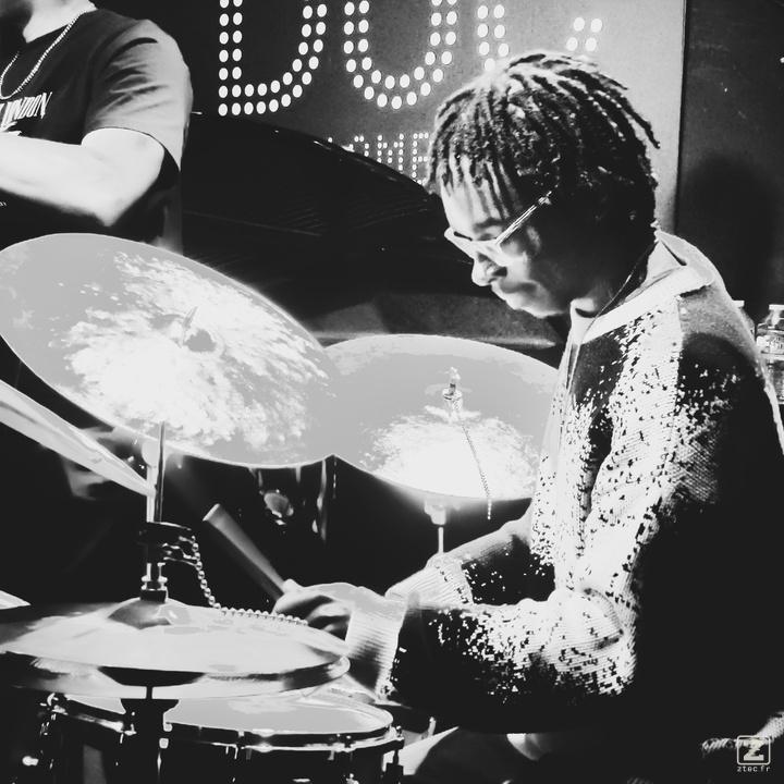 Koleby Royston playing drums at Theo Croker concert