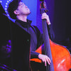 Shimpei Ogawa is playing double bass and enjoy it, eyes closed.