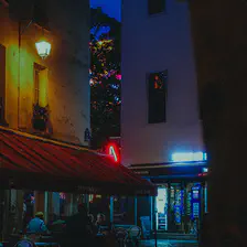 Parisian street with a man walks by a typical bar.
https://www.flickr.com/photos/ztec/53885194516/