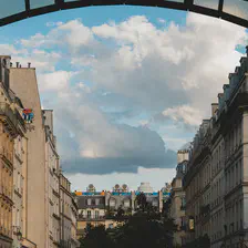 Typical parisians building with some elements from the Beaubourg museum over the roof of the center building. 