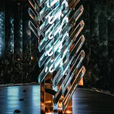 A set of modern squared crystals handing from the ceiling with light shining though. Taken at Národní divadlo
https://www.flickr.com/photos/ztec/53162881407/