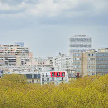 Paris roof top buildings in the nature with red window/balcony