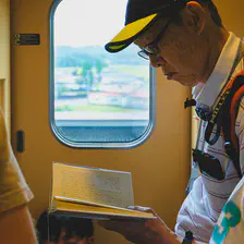 A man read a book in a train