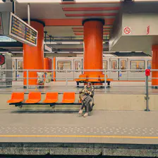 Train stations with orange seats and orange walls. An orange from the 60's 